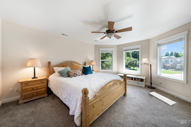 bedroom featuring carpet floors, visible vents, ceiling fan, and baseboards