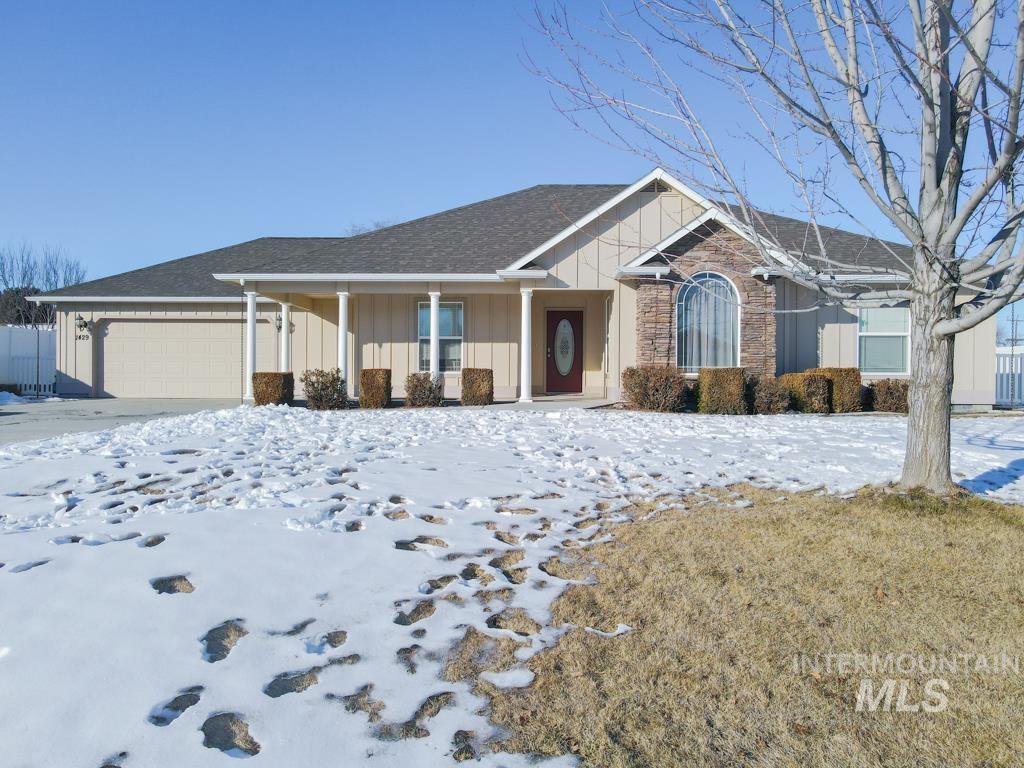 ranch-style house featuring a garage