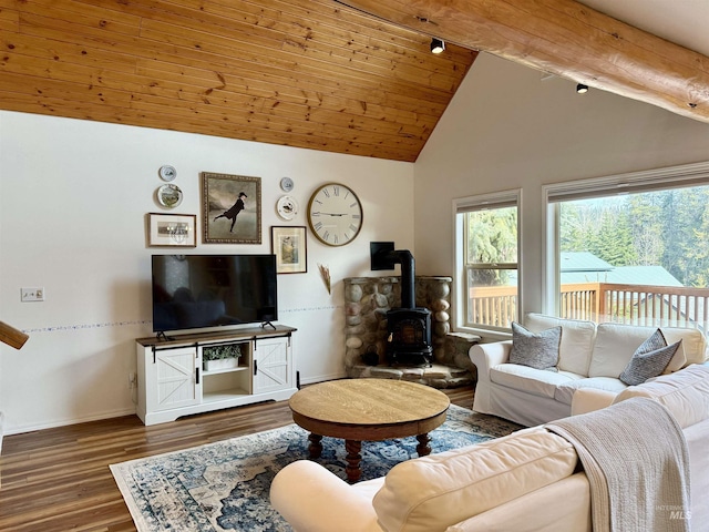 1425 Clements, Mccall, ID 83638 - living area with a wood stove, wood finished floors, baseboards, high vaulted ceiling, and wood ceiling