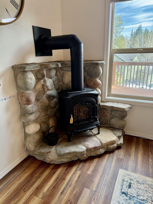 1425 Clements, Mccall, ID 83638 - detailed view of a wood stove, wood finished floors, and baseboards