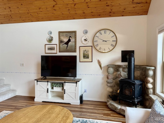 1425 Clements, Mccall, ID 83638 - living area with a wood stove, wood finished floors, baseboards, and stairway