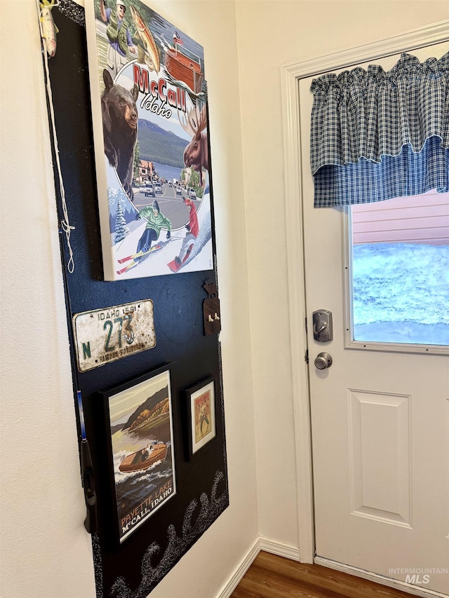 1425 Clements, Mccall, ID 83638 - doorway to outside featuring wood finished floors
