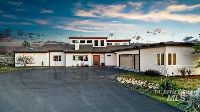4336 N Star Vista Ln, Eagle, ID 83616 - view of front of property with driveway, a garage, and stucco siding