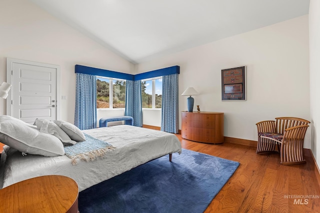 4336 N Star Vista Ln, Eagle, ID 83616 - bedroom with wood finished floors, vaulted ceiling, and baseboards