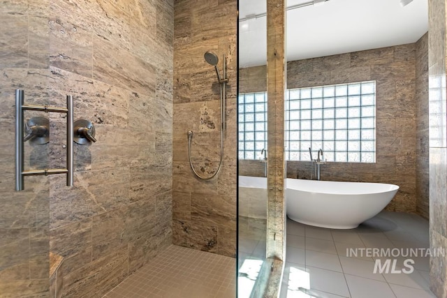 4336 N Star Vista Ln, Eagle, ID 83616 - full bath with a tile shower, a freestanding bath, tile patterned flooring, and tile walls