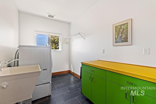 4336 N Star Vista Ln, Eagle, ID 83616 - laundry room with washer / dryer, baseboards, and cabinet space