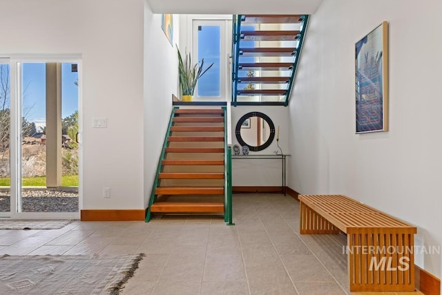 4336 N Star Vista Ln, Eagle, ID 83616 - stairs featuring baseboards and tile patterned flooring