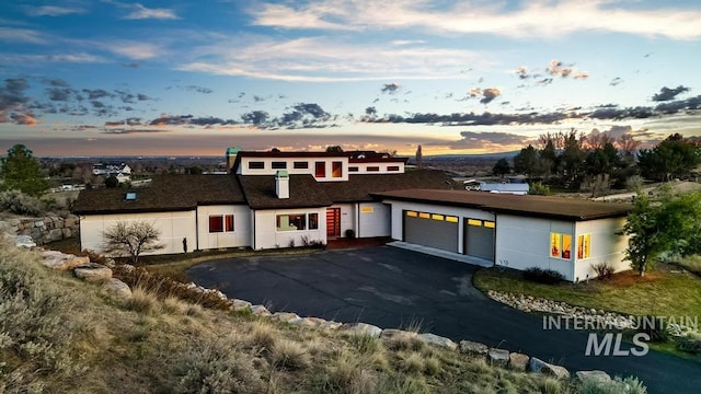 4336 N Star Vista Ln, Eagle, ID 83616 - view of front of home featuring a garage and asphalt driveway