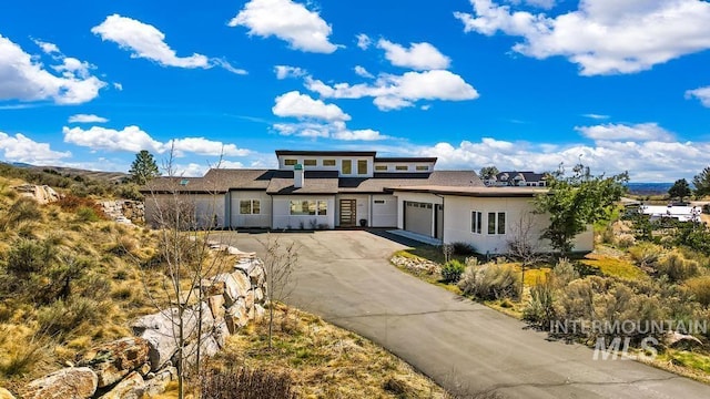 4336 N Star Vista Ln, Eagle, ID 83616 - prairie-style house with asphalt driveway and an attached garage