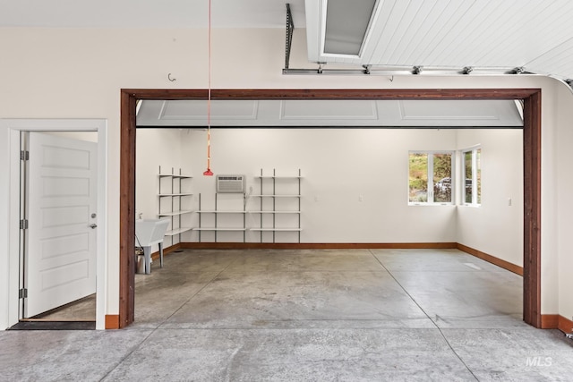 4336 N Star Vista Ln, Eagle, ID 83616 - garage with baseboards and an AC wall unit