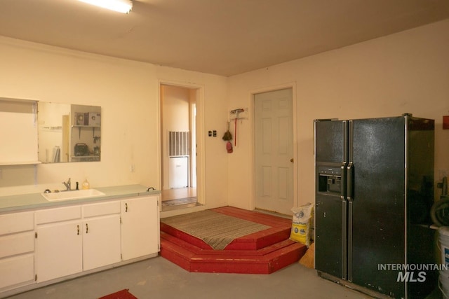 bathroom with concrete floors and vanity