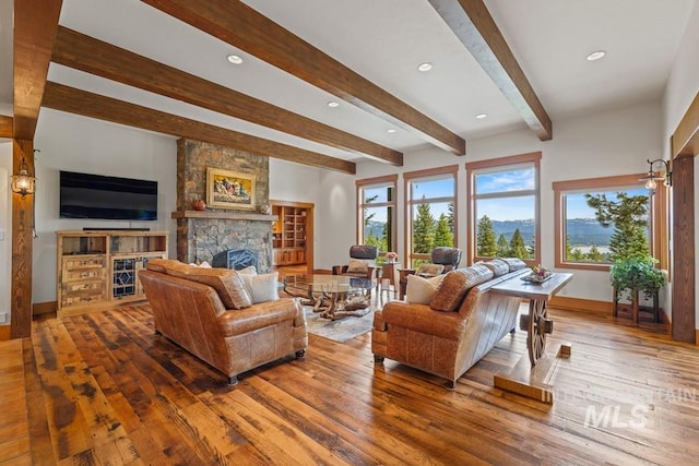 1418 Club Hill Blvd, Mccall, ID 83638 - living area with baseboards, hardwood / wood-style floors, a fireplace, beamed ceiling, and recessed lighting