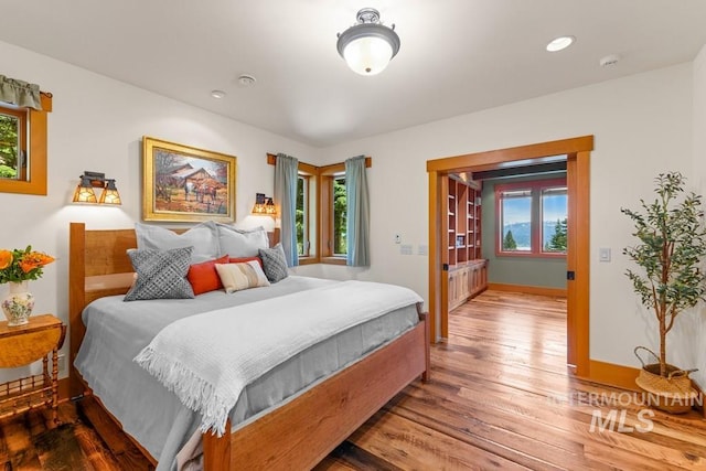 1418 Club Hill Blvd, Mccall, ID 83638 - bedroom featuring hardwood / wood-style floors, multiple windows, and recessed lighting