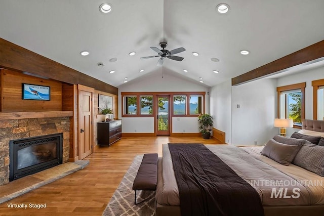 1418 Club Hill Blvd, Mccall, ID 83638 - bedroom with a stone fireplace, recessed lighting, lofted ceiling, light wood-type flooring, and access to outside
