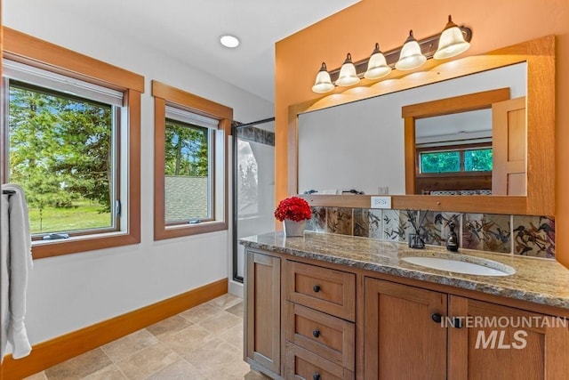 1418 Club Hill Blvd, Mccall, ID 83638 - full bathroom with vanity, baseboards, an enclosed shower, and tile patterned floors