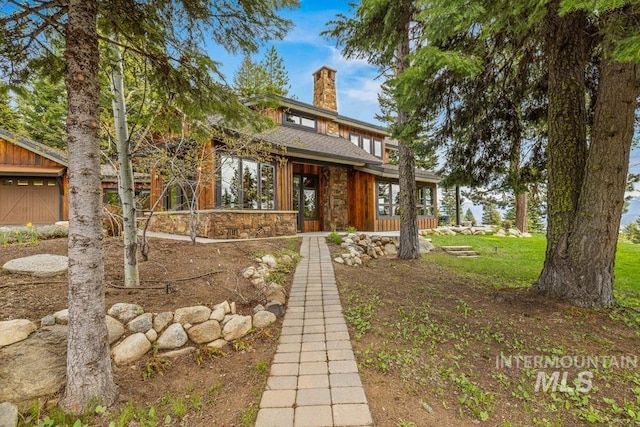 1418 Club Hill Blvd, Mccall, ID 83638 - mid-century modern home with a chimney and stone siding