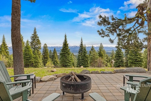 1418 Club Hill Blvd, Mccall, ID 83638 - view of patio featuring an outdoor fire pit and a view of trees