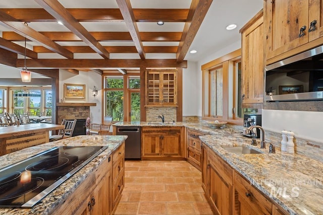 1418 Club Hill Blvd, Mccall, ID 83638 - kitchen with appliances with stainless steel finishes, a sink, beamed ceiling, healthy amount of natural light, and a stone fireplace