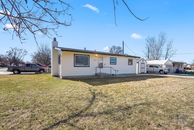 923 13th St S, Nampa, ID 83651 - ranch-style house featuring a chimney and a front yard