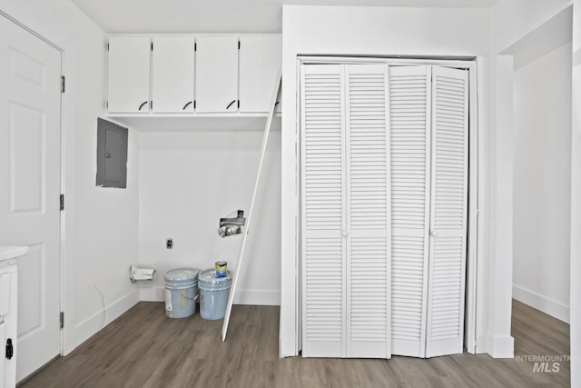 923 13th St S, Nampa, ID 83651 - washroom with electric panel, baseboards, and wood finished floors