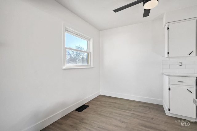 923 13th St S, Nampa, ID 83651 - unfurnished room featuring baseboards, ceiling fan, and wood finished floors