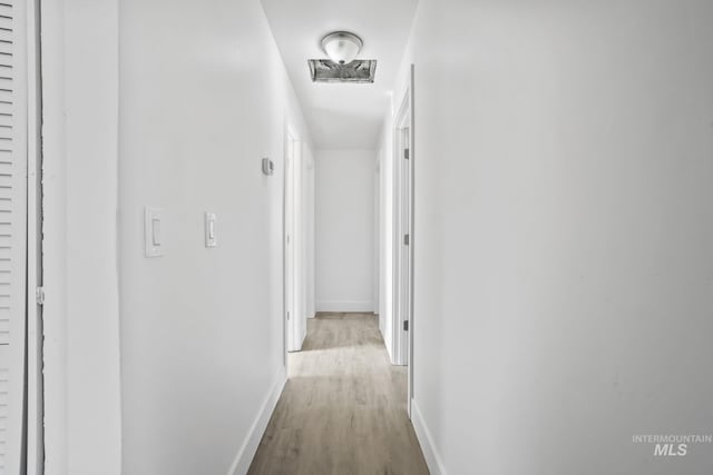 923 13th St S, Nampa, ID 83651 - corridor with wood finished floors and baseboards