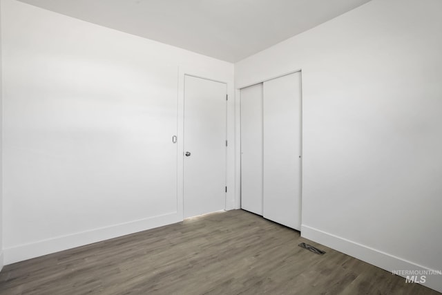 923 13th St S, Nampa, ID 83651 - unfurnished bedroom featuring wood finished floors, a closet, and baseboards