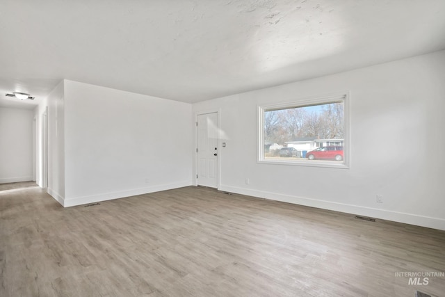 923 13th St S, Nampa, ID 83651 - spare room featuring wood finished floors and baseboards