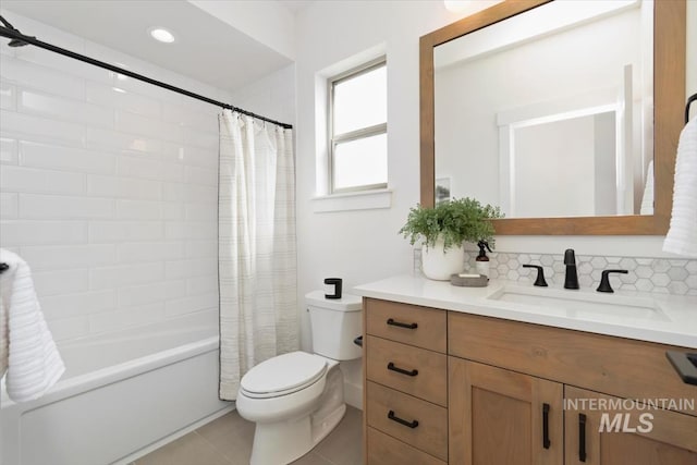 full bathroom with toilet, decorative backsplash, shower / bath combo, vanity, and tile patterned floors