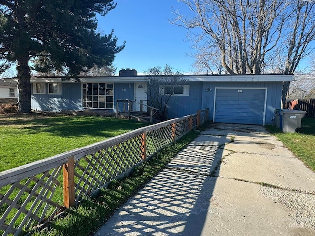 single story home with a garage and a front yard