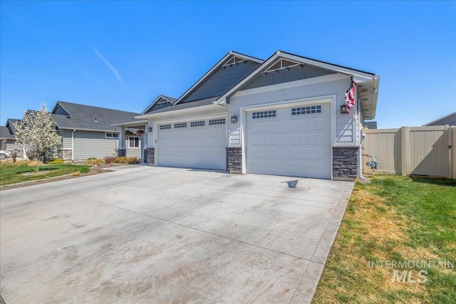 18272 N Wild Goose Ave, Nampa, ID 83687 - craftsman house with stone siding, a garage, and concrete driveway