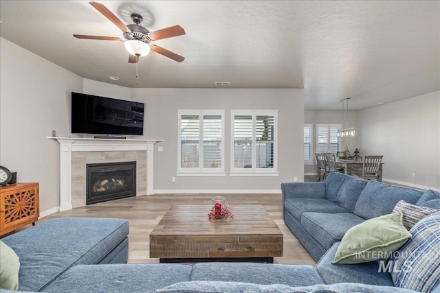 18272 N Wild Goose Ave, Nampa, ID 83687 - living room featuring wood finished floors, ceiling fan, and baseboards