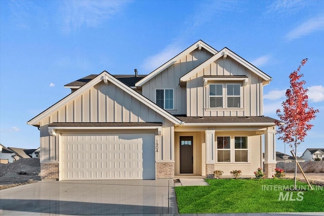 7766 W Daybreak Run Ct, Meridian, ID 83646 - craftsman-style house featuring brick siding, board and batten siding, an attached garage, concrete driveway, and a front lawn