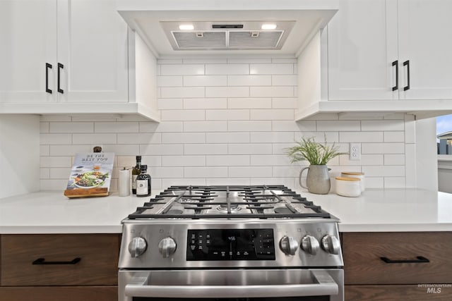 7766 W Daybreak Run Ct, Meridian, ID 83646 - kitchen featuring stainless steel gas stove, light countertops, white cabinets, and decorative backsplash