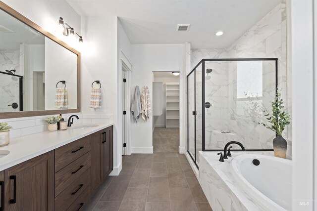 7766 W Daybreak Run Ct, Meridian, ID 83646 - full bath featuring a bath, double vanity, a marble finish shower, a walk in closet, and recessed lighting