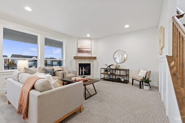 7766 W Daybreak Run Ct, Meridian, ID 83646 - living room featuring light carpet, a high end fireplace, stairway, and recessed lighting
