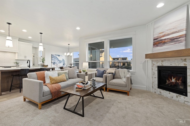 7766 W Daybreak Run Ct, Meridian, ID 83646 - living area with recessed lighting, a chandelier, and a premium fireplace