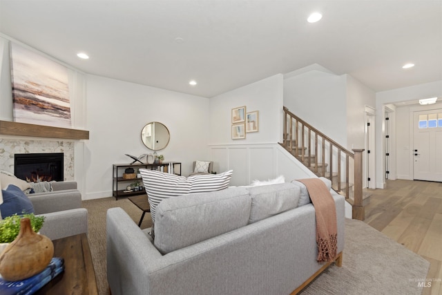 7766 W Daybreak Run Ct, Meridian, ID 83646 - living area with stairway, a fireplace, recessed lighting, and wood finished floors