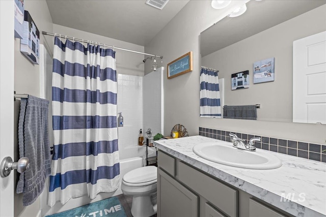 941 S Wavetrain Ave, Boise, ID 83709 - bathroom with vanity, toilet, shower / bath combination with curtain, and tasteful backsplash