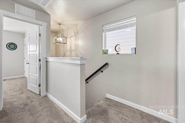 941 S Wavetrain Ave, Boise, ID 83709 - staircase with carpet flooring, baseboards, and a chandelier