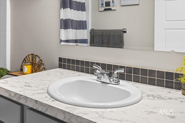 941 S Wavetrain Ave, Boise, ID 83709 - full bath with vanity, a shower with shower curtain, and tasteful backsplash