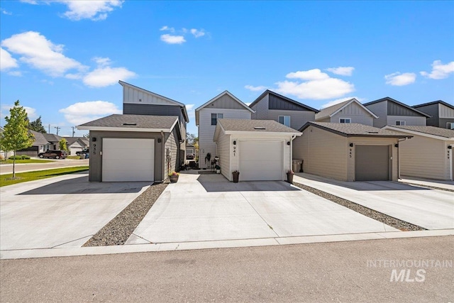 941 S Wavetrain Ave, Boise, ID 83709 - view of front of property with board and batten siding, an attached garage, concrete driveway, and a residential view