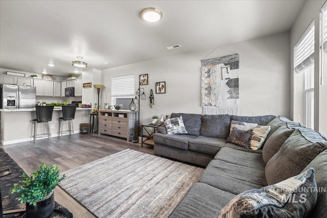 941 S Wavetrain Ave, Boise, ID 83709 - living area with dark wood finished floors