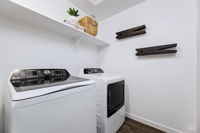 laundry room featuring dark hardwood / wood-style floors and separate washer and dryer