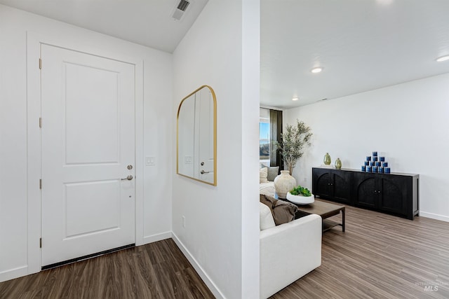 entryway with hardwood / wood-style floors