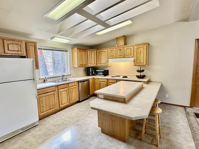 1089 Wallen Rd, Moscow, ID 83843 - kitchen featuring white appliances, under cabinet range hood, a peninsula, a breakfast bar, and light countertops