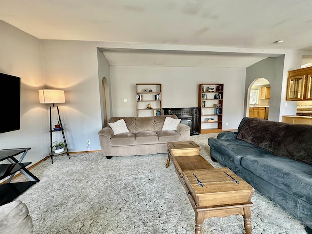1089 Wallen Rd, Moscow, ID 83843 - living area featuring arched walkways and carpet flooring