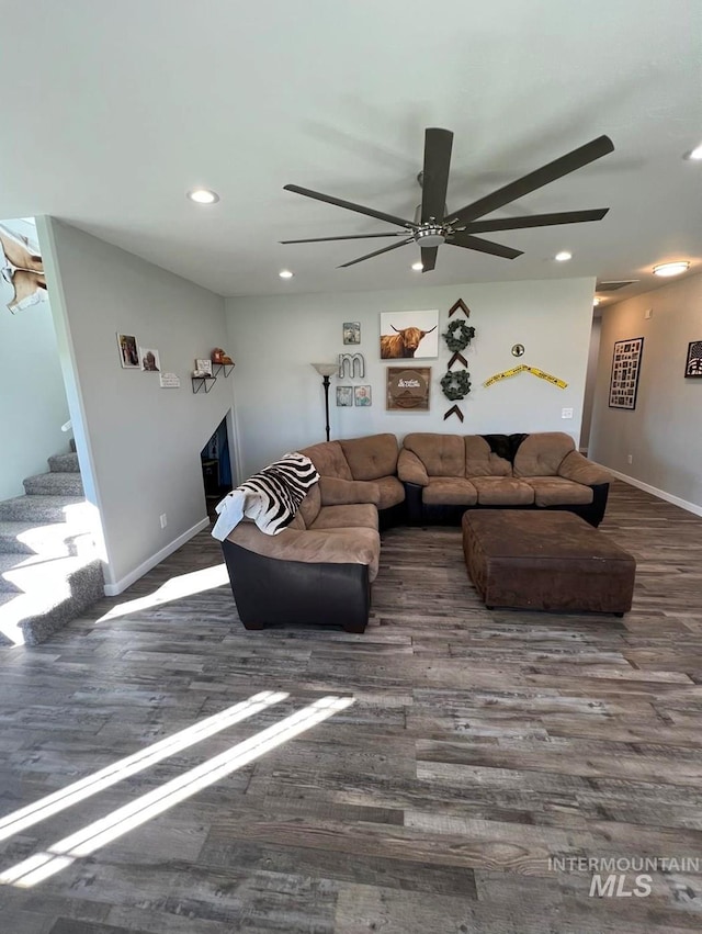living room with recessed lighting, wood finished floors, ceiling fan, and stairs