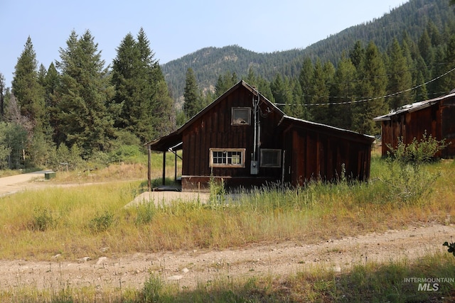 view of outbuilding with a mountain view