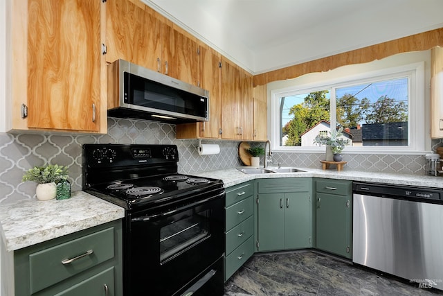 kitchen featuring sink, stainless steel appliances, and tasteful backsplash